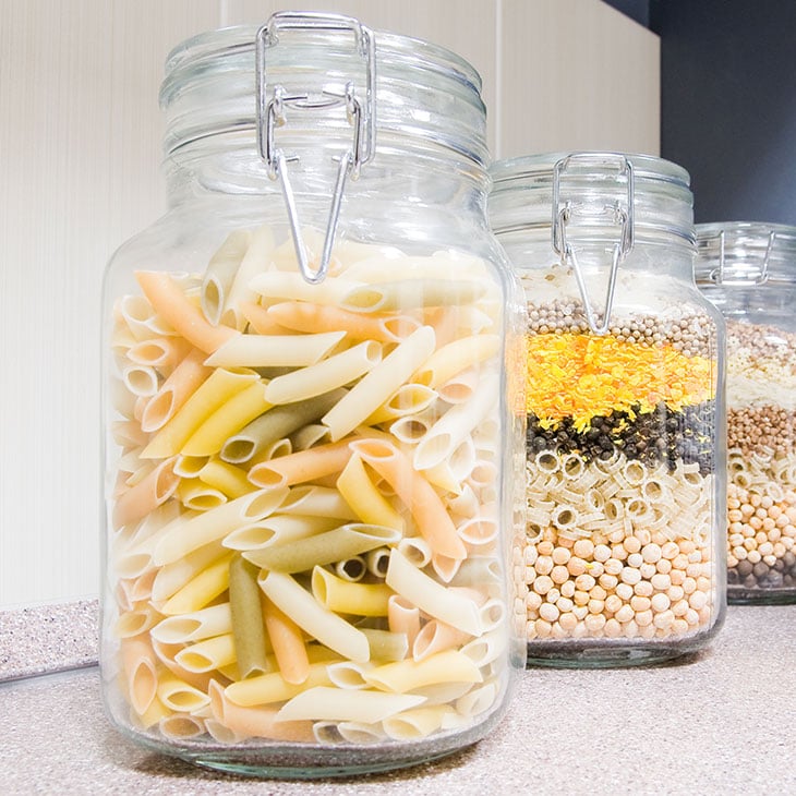 Glass jars filled with pasta and spices