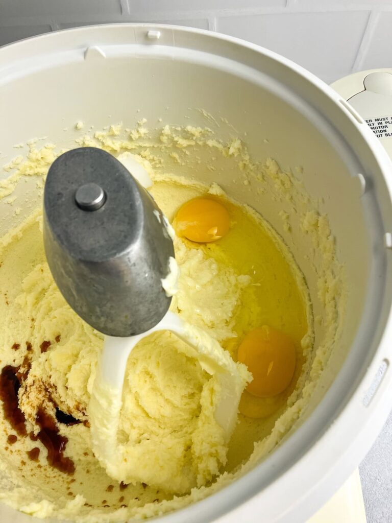 Eggs and vanilla added to the creamed butter mixture.