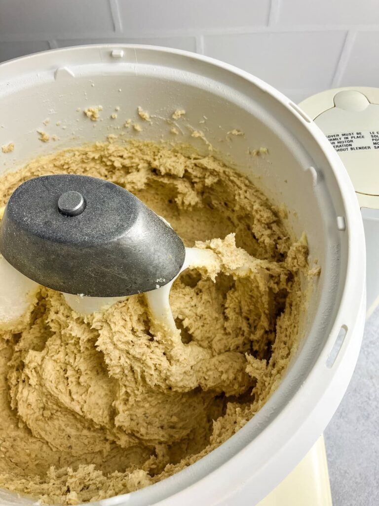 Oatmeal cookie dough in a stand mixer.