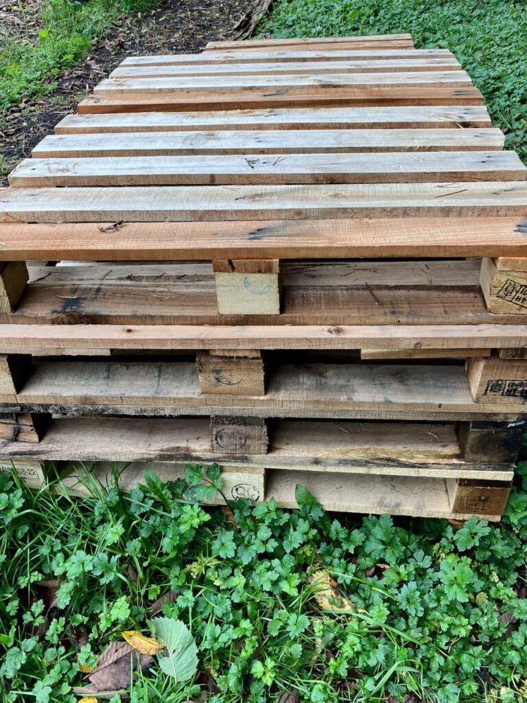A stack of pallets gathered for free firewood.
