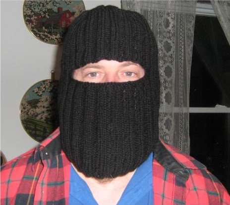 A man wearing a hand-knit balaclava.