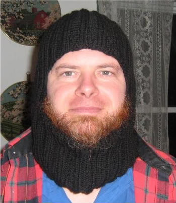 A man wearing a hand-knit balaclava.