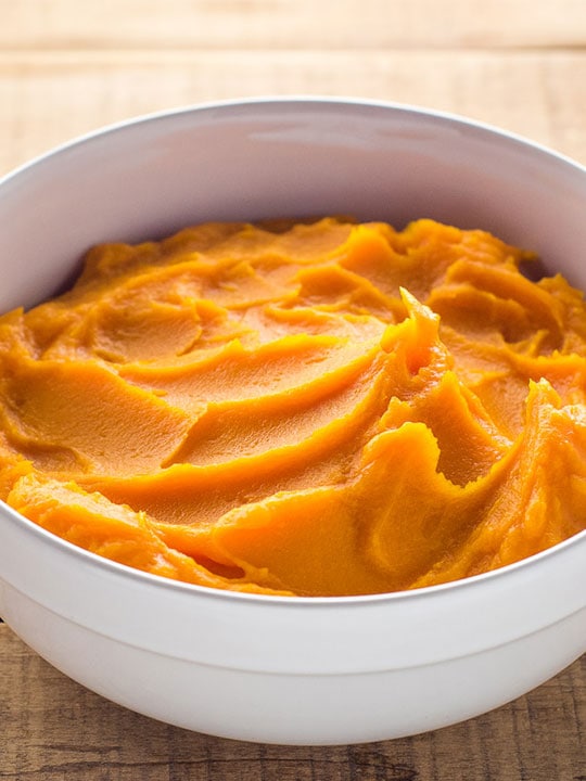 White serving bowl of homemade butternut squash puree.