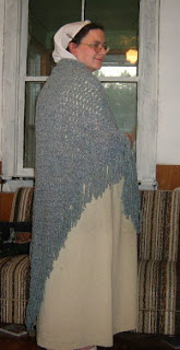 Me wearing a large grey triangle shawl.