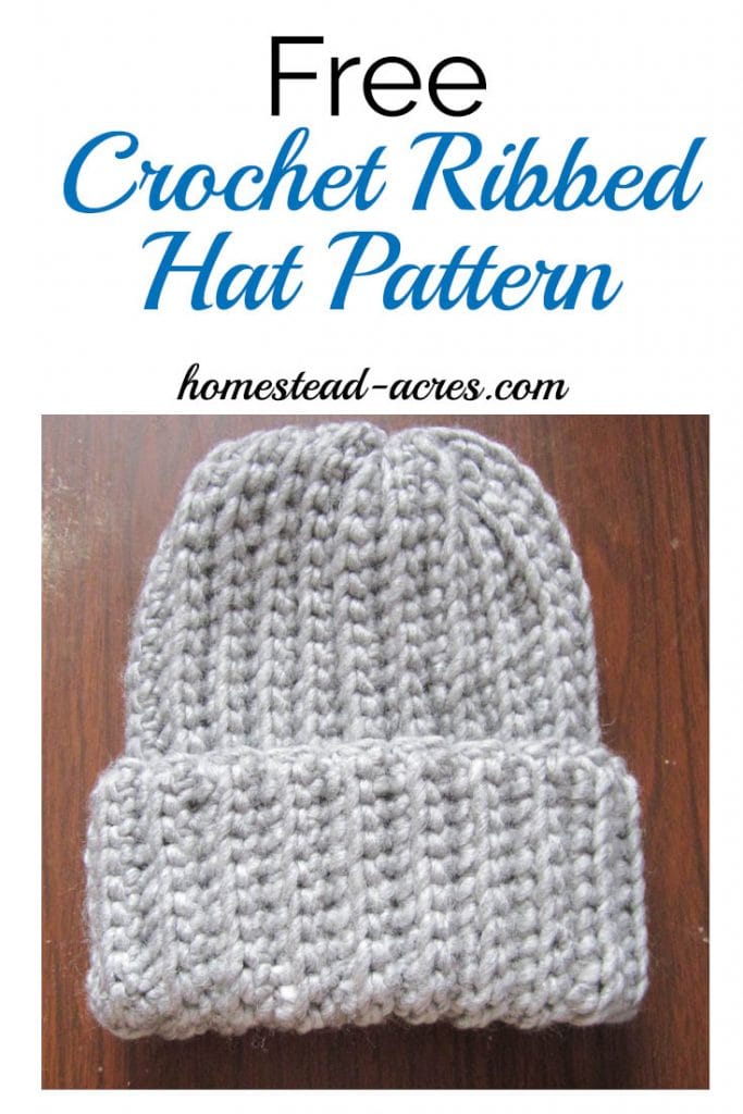 Bulky gray crochet ribbed hat on a wooden table. Text overlay says Free Crochet Ribbed Hat Pattern.