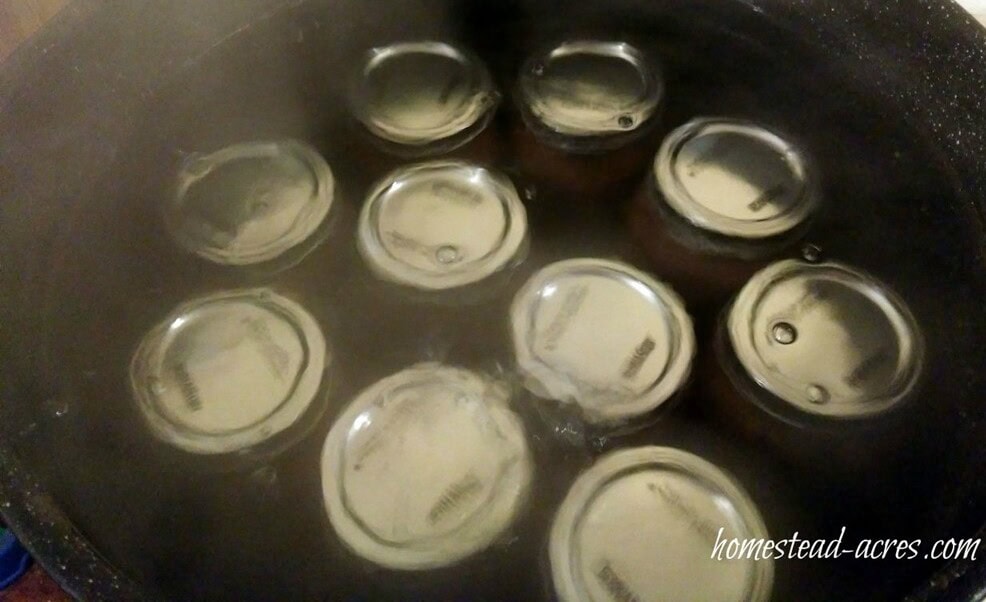Jars of pear butter in a water bath canner.