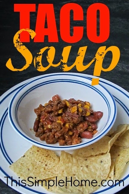 Taco soup in a bowl with chips on. the side.