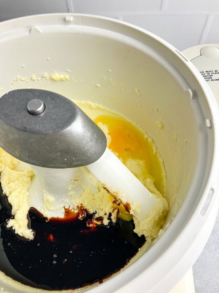 Adding egg and molasses to the butter mixture.