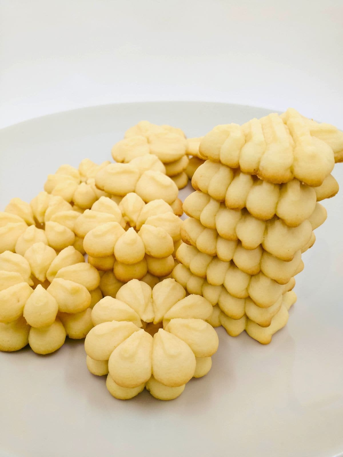 Christmas butter cookies on a white plate.