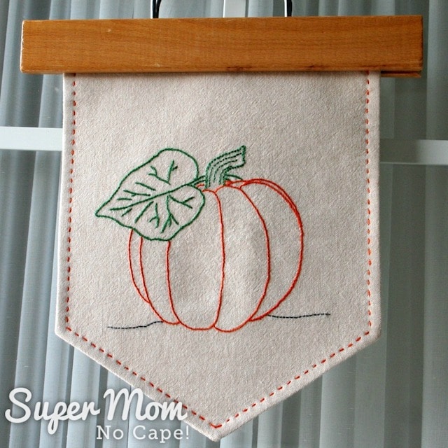 Homemade pumpkin banner hanging on a door.
