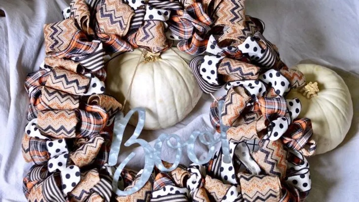 Fall wreath with halloween burlap ribbon.