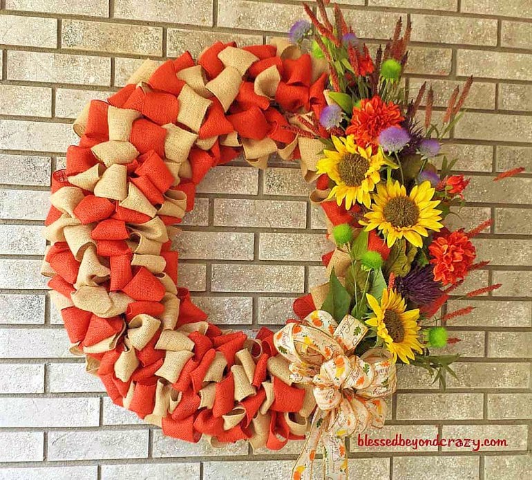 DIY fall orange and tan burlap wreath with sunflowers.