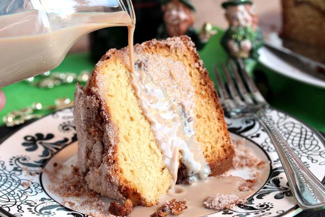 Pouring Bailey's on the cake.