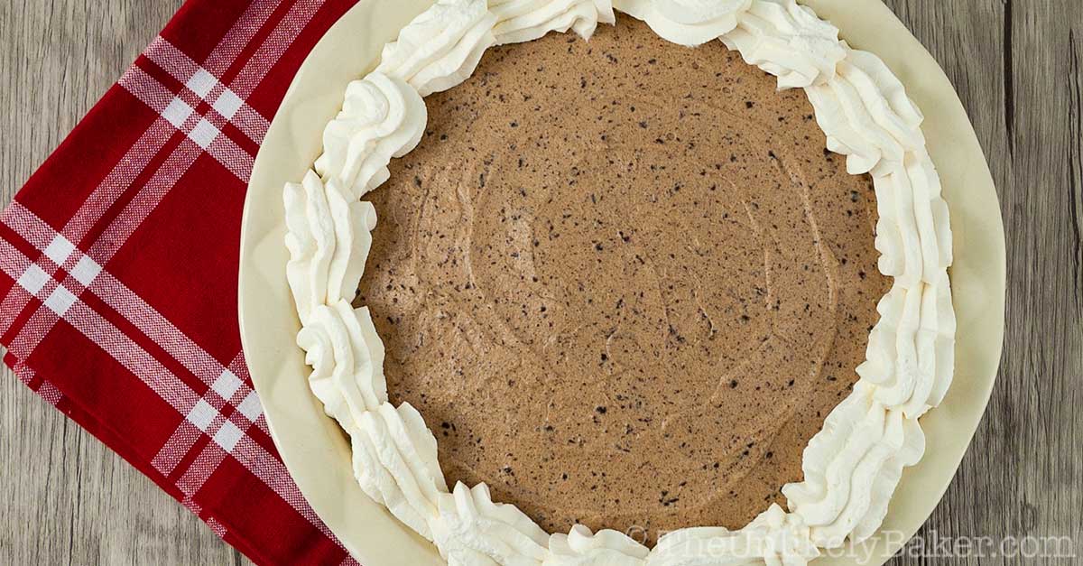 Baileys chocolate mousse pie on a wooden table.