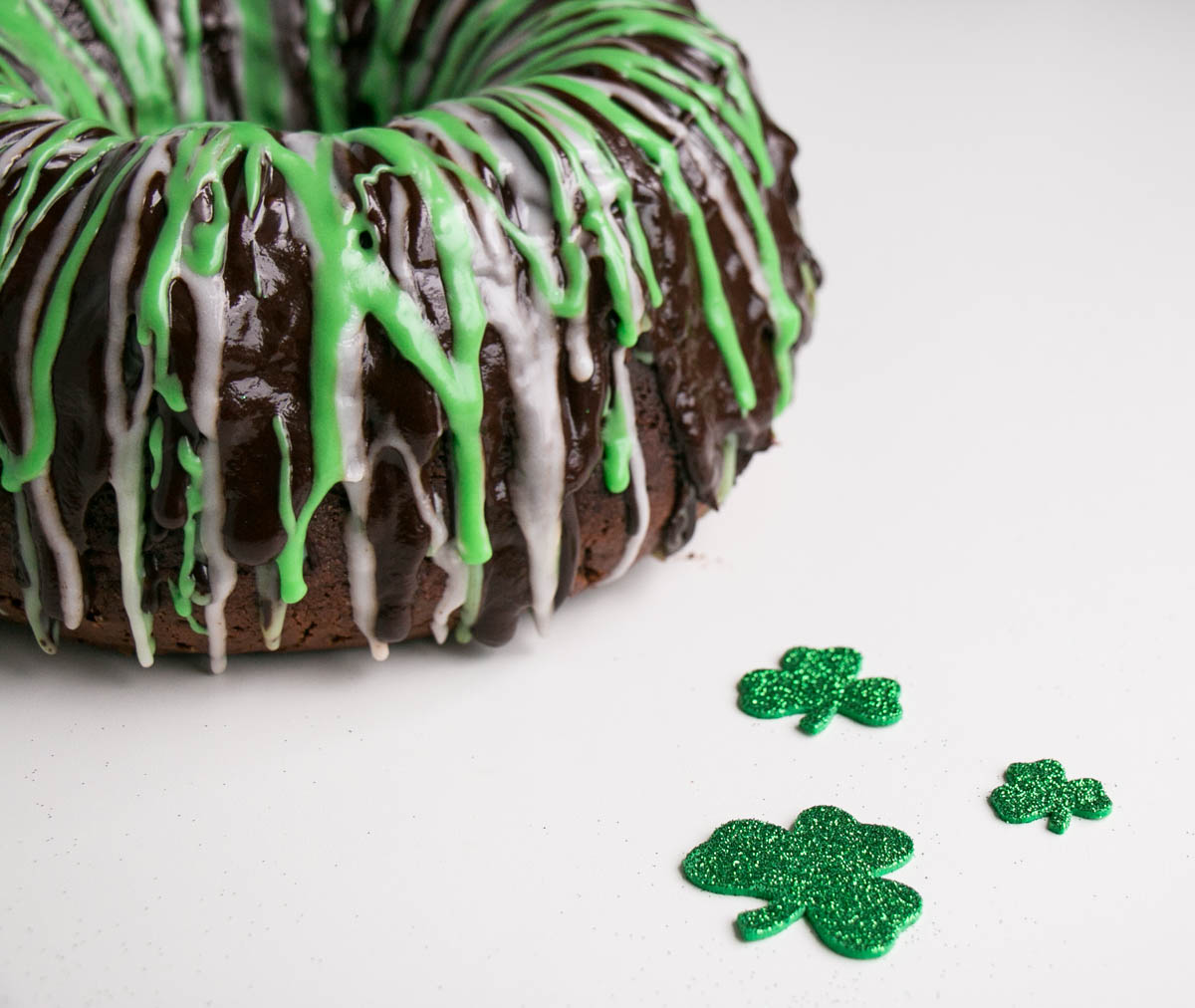 Chocolate mint bundt cake with green and white glaze.