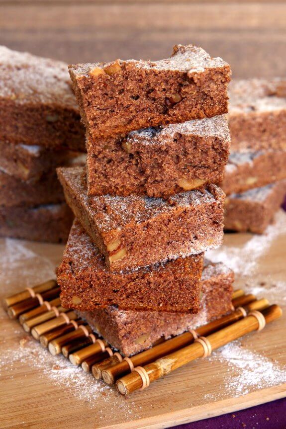 Stacks of Irish blackberry cakes on a wooden cutting board.