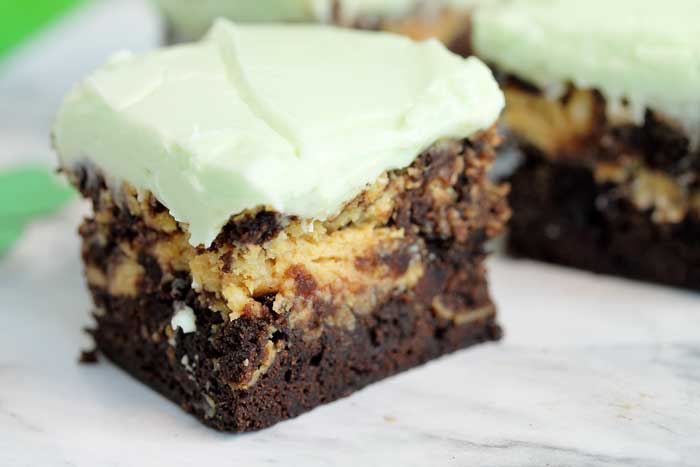 Key lime cheesecake brownies with green icing.