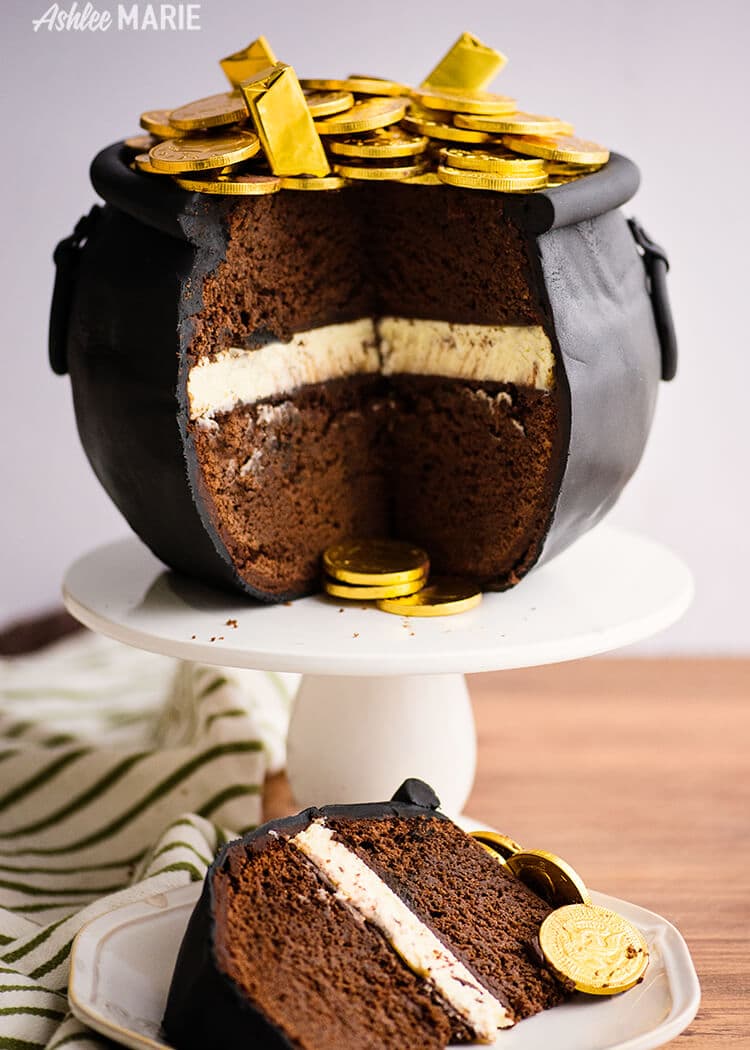 Pot of gold cake on a white cake stand.