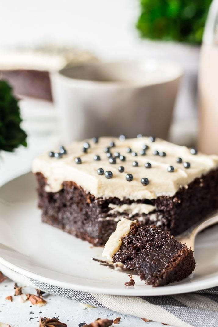 Chocolate Irish cream cake on a white dessert place.