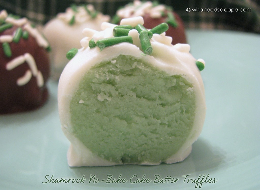 Green shamrock cake truffles coated in chocolate.