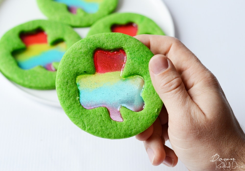 Green stained glass shamrock cookies.