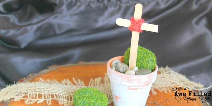 Easter cross made from a popsicle stick and mini flower pot.