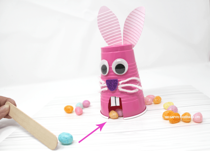 Feed the Easter bunny game made from a plastic cup.