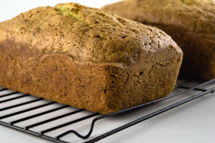 Cooling zucchini bread on wire racks.