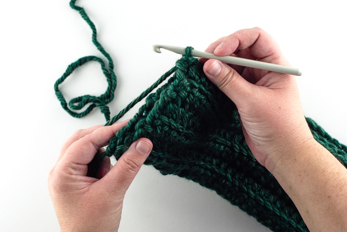 Slip stitching the scarf ends together.