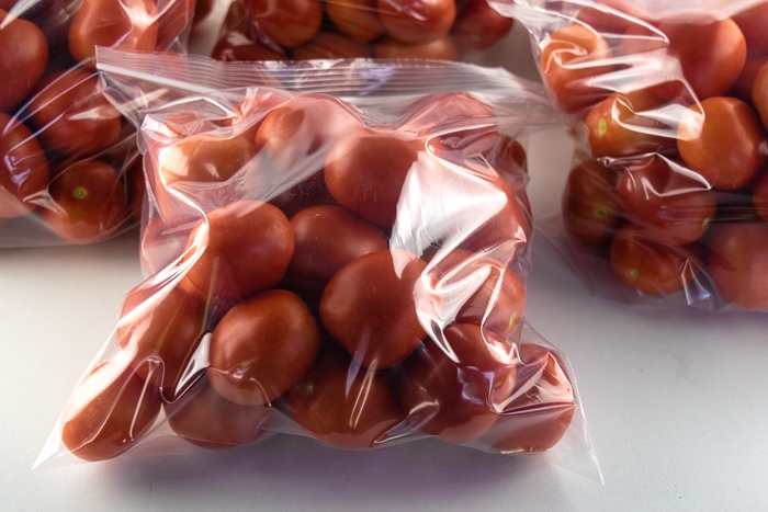 Bags of tomatoes ready to go in the freezer.
