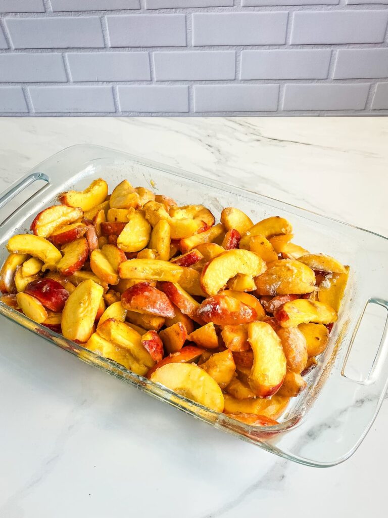 Fresh sliced peaches mixed with flour to thicken when baked.