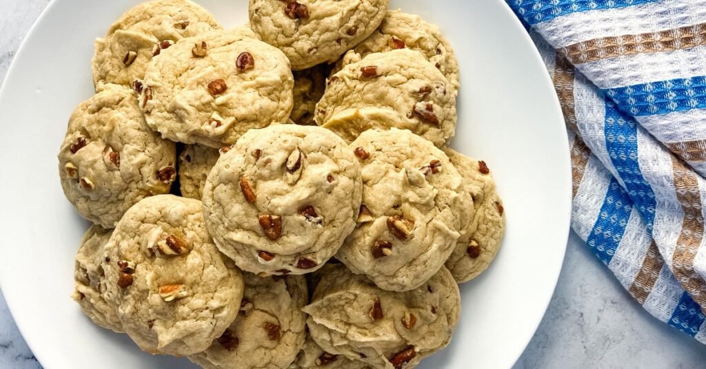 A plate filled with butter pecan cake mix cookies.
