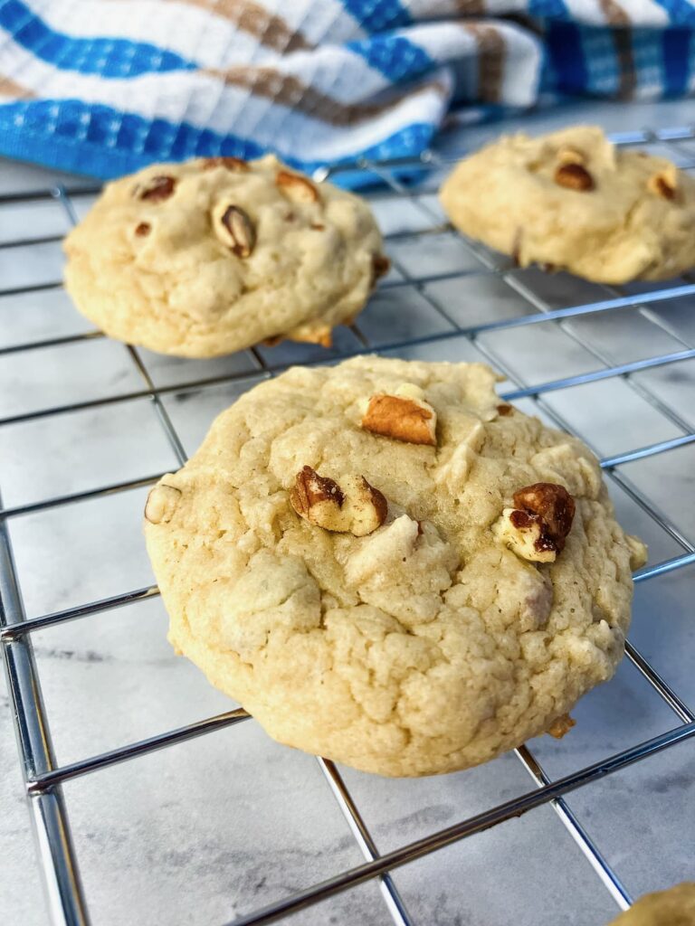 Butter pecan cookies cooling on a wire rack.