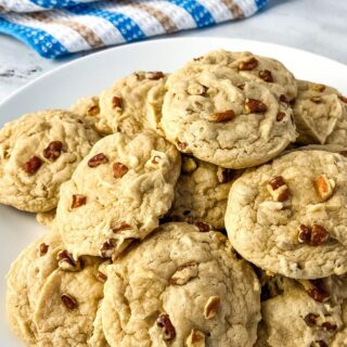A white plate filled with butter pecan cake mix cookies.