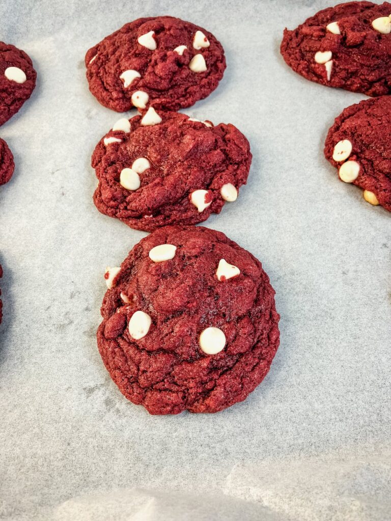 Cookies on a parchment lined cookie sheet.