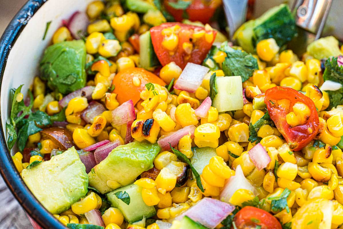 Serving bowl filled with homemade corn salad.