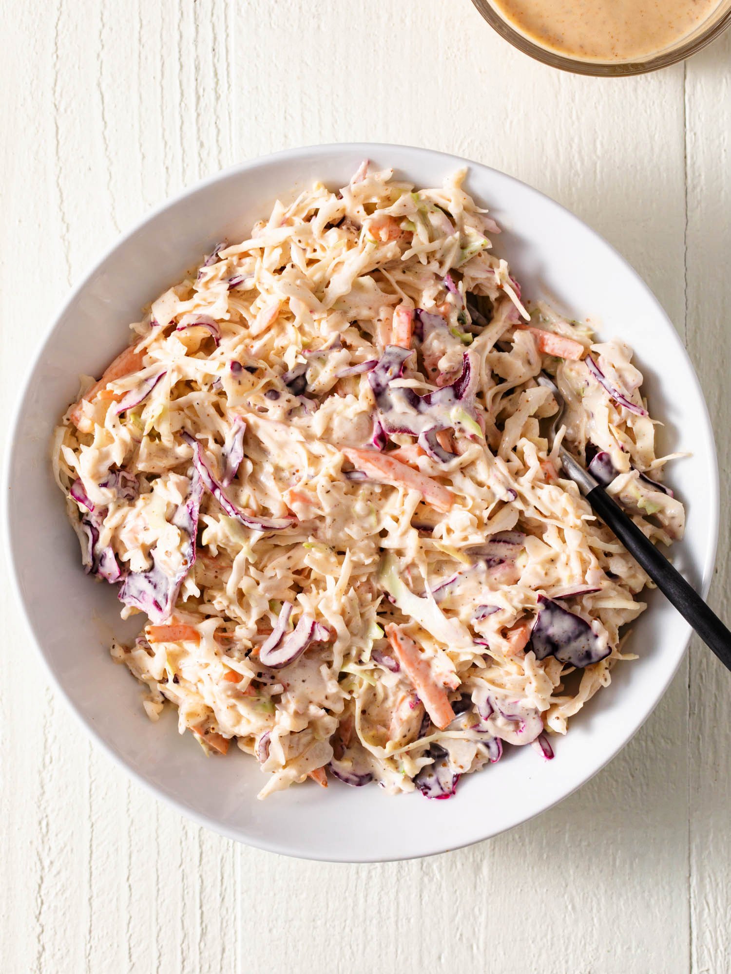 BBQ coleslaw in a white bowl.