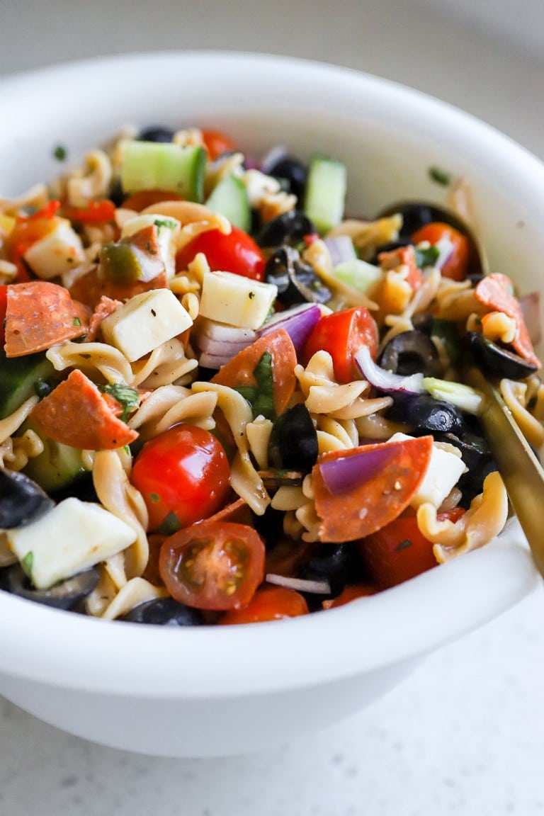 Italian pasta salad in a white bowl.