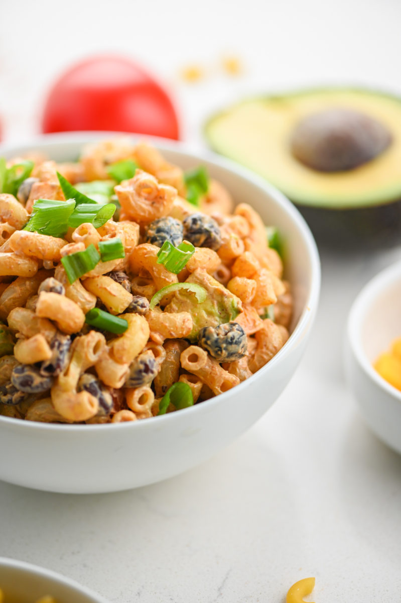 A white bowl filled with a pasta salad dip.
