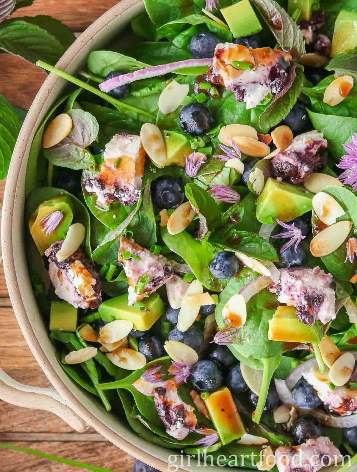 Blueberry and spinach salad in a serving bowl.
