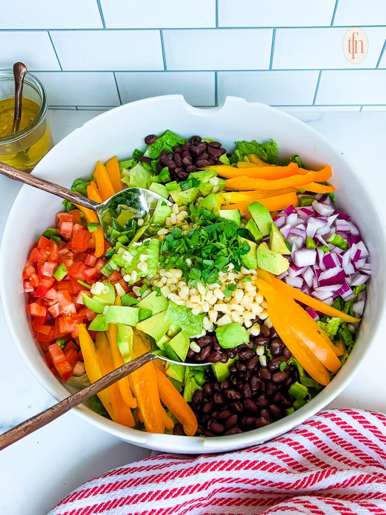 Cowboy salad in a white serving bowl.