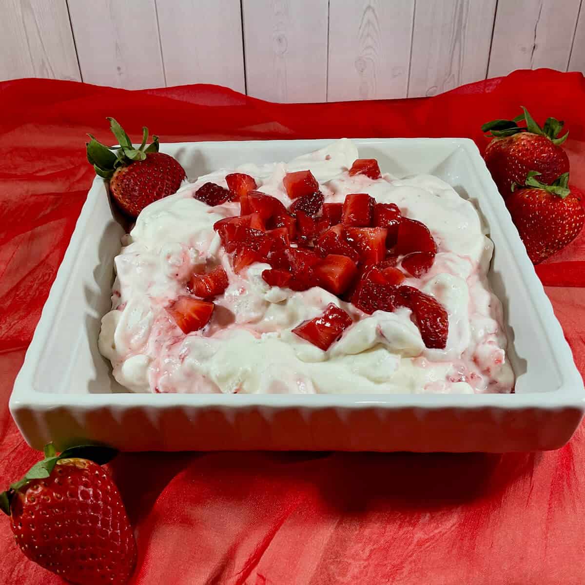 Eaton mess with fresh strawberries in a serving dish.