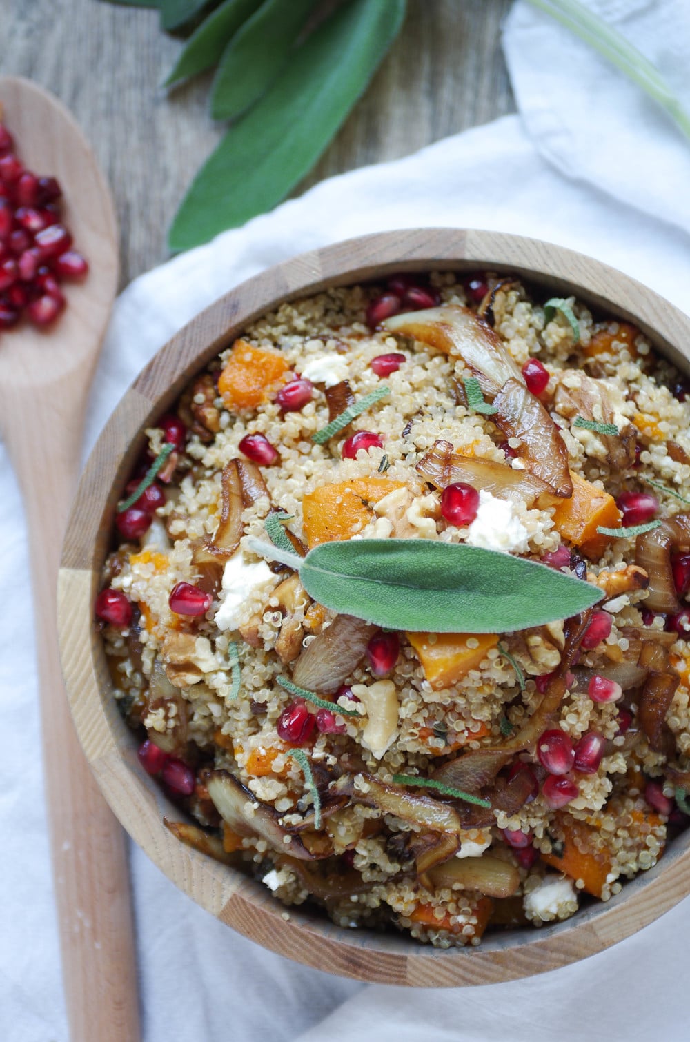 Fall quinoa salad in a wooden bowl.