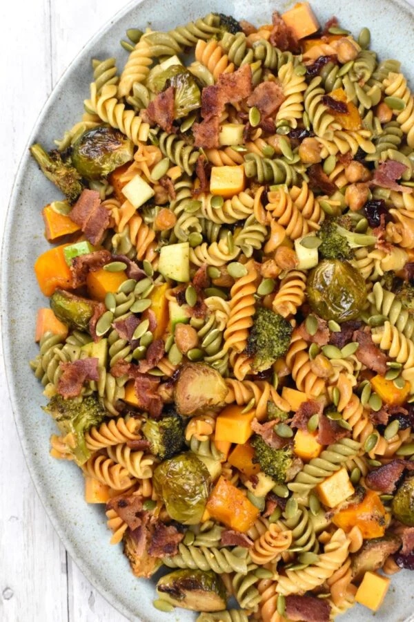 Fall pasta salad with butternut squash on a large white serving platter.