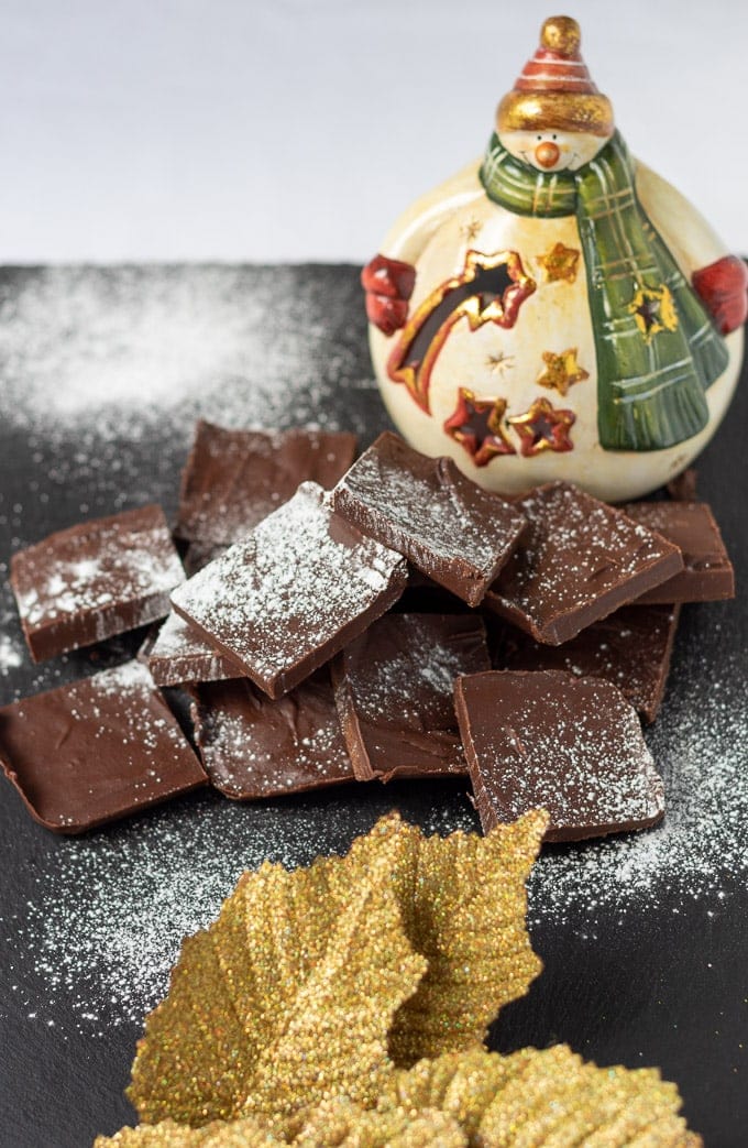 Peppermint fudge cut into squares and dusted with powdered sugar.
