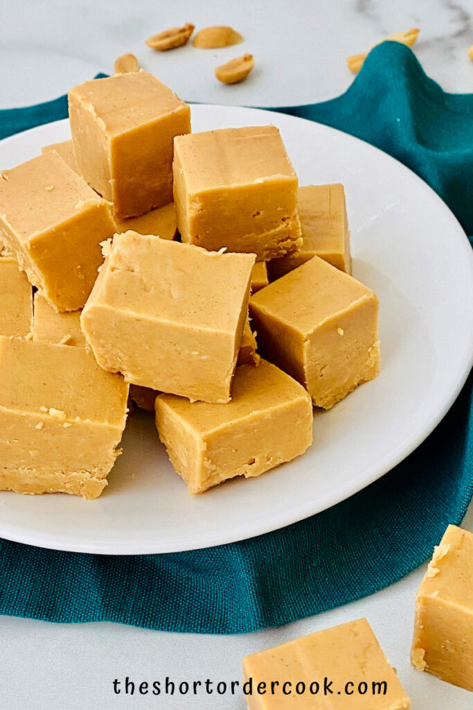 Peanut butter fudge cut into slices on a plate.