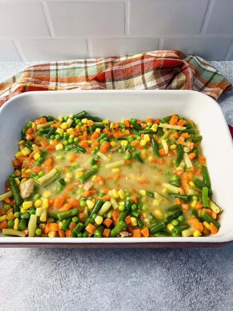 Homemade gravy added to the vegetable and turkey mixture.