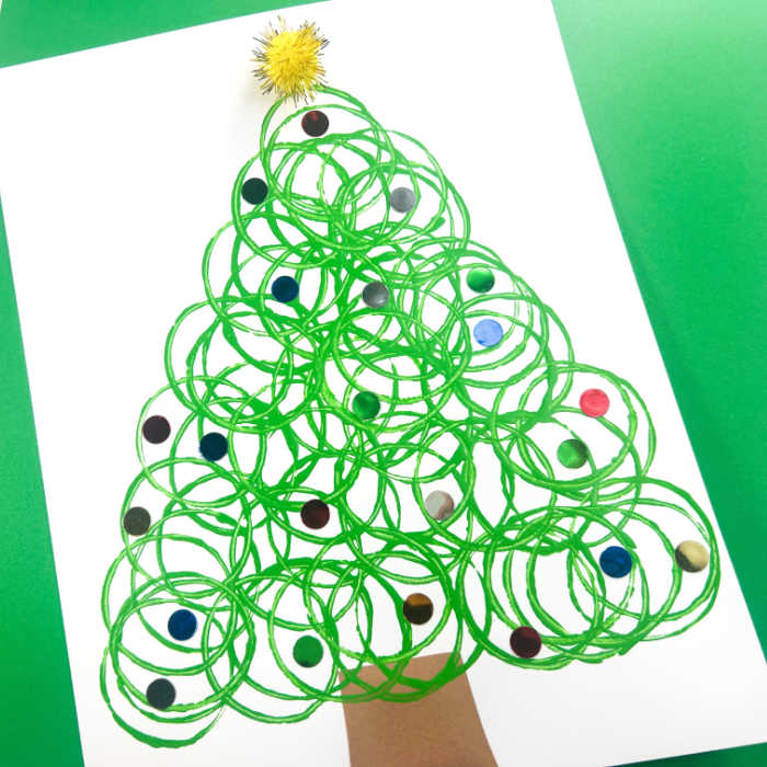 Christmas tree painting made by stamping toilet paper rolls.