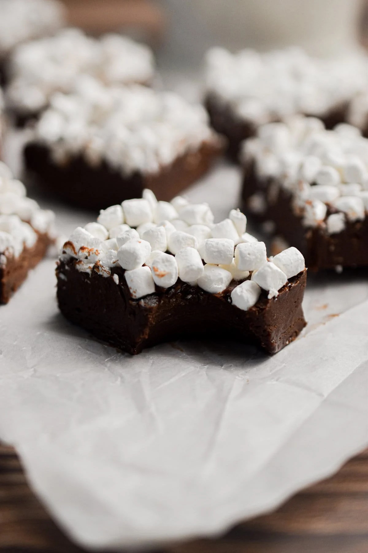Slices of hot cocoa fudge with mini marshmallows on top.