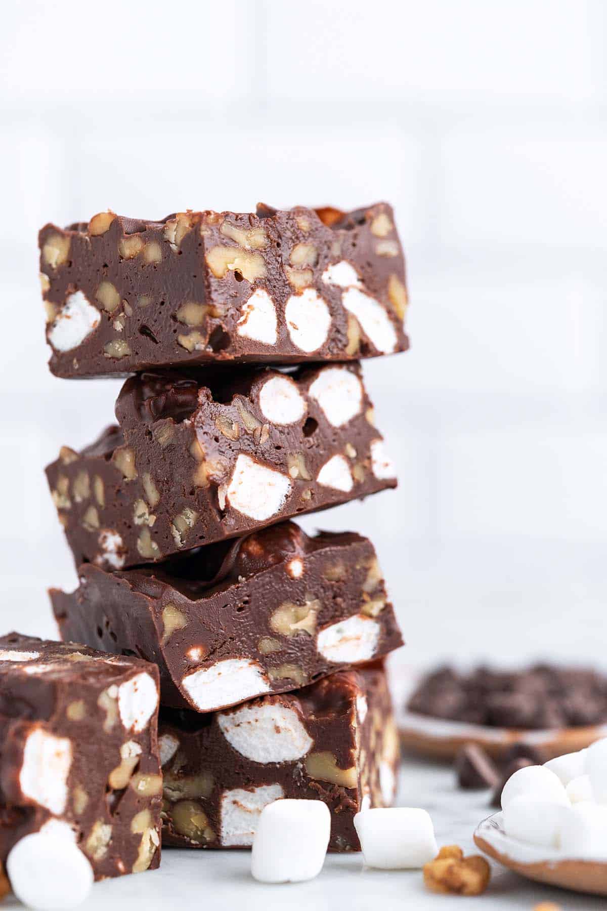 Stacked squares of microwave rocky road fudge.